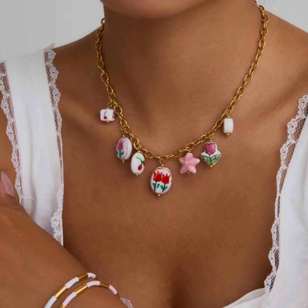 Gold-plated necklace with ceramic charms, made of titanium stainless steel.